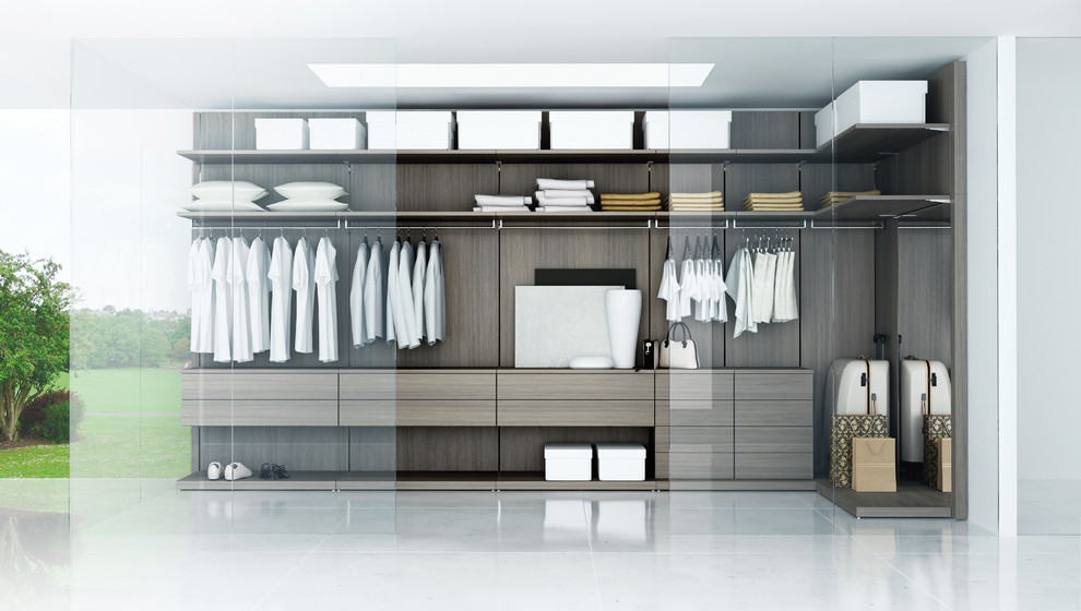 This is an example of a mid-sized modern walk-in wardrobe in New York with open cabinets and medium wood cabinets.