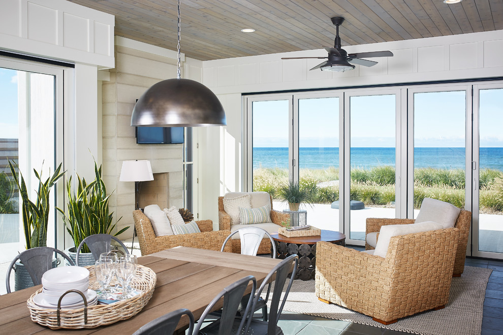 Inspiration for a beach style sunroom in Grand Rapids with a standard fireplace and a standard ceiling.