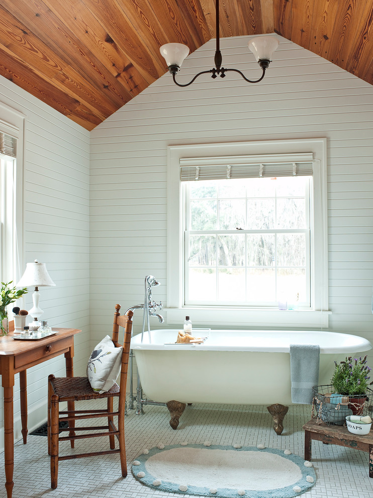 Design ideas for a traditional bathroom in Atlanta with a claw-foot tub and white tile.
