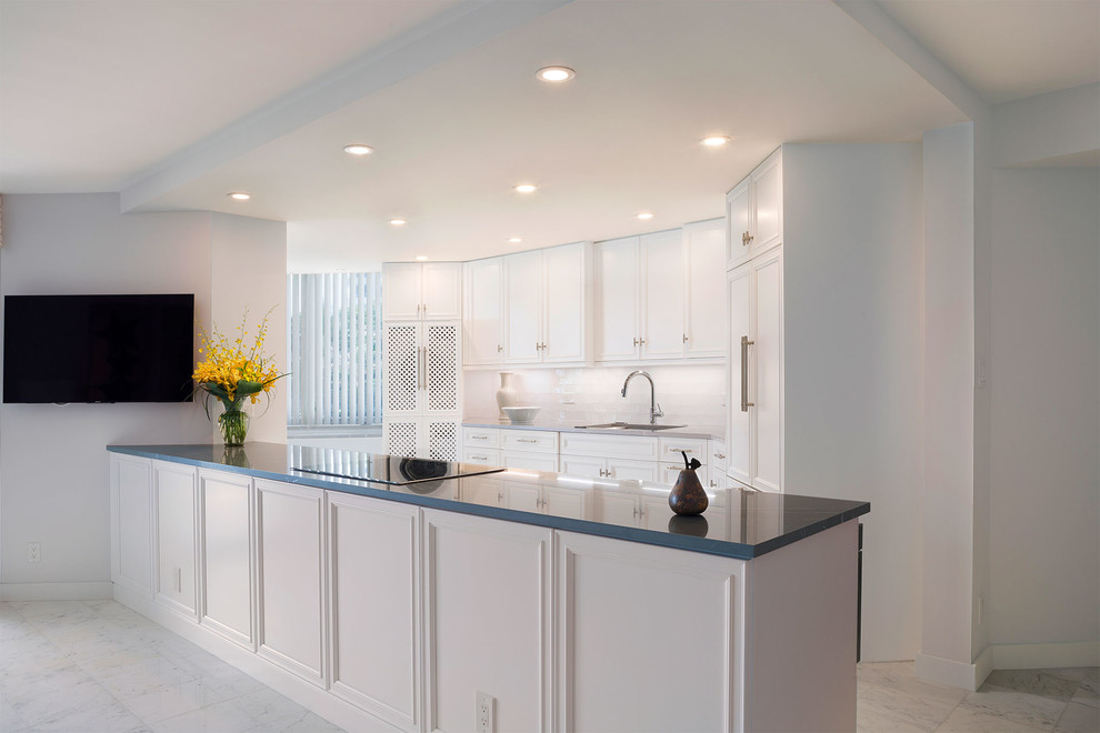Open concept kitchen - mid-sized transitional l-shaped ceramic tile and beige floor open concept kitchen idea in Miami with an undermount sink, recessed-panel cabinets, white cabinets, marble countertops, multicolored backsplash, mosaic tile backsplash, stainless steel appliances, an island and multicolored countertops