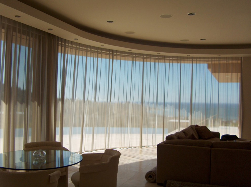 Large minimalist formal and enclosed marble floor and beige floor living room photo in San Diego with beige walls, no fireplace and no tv