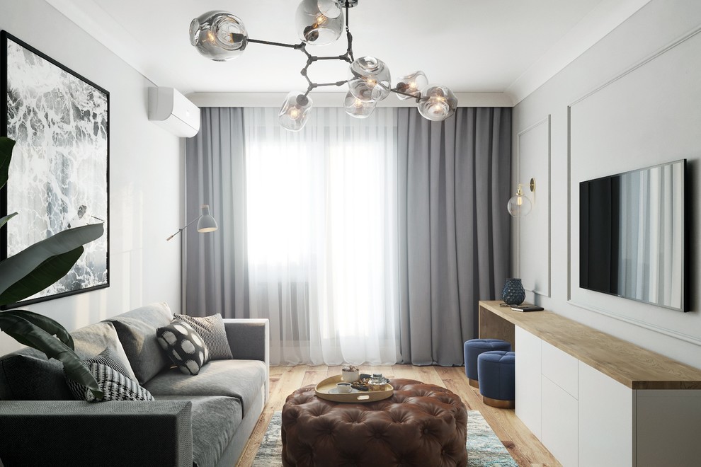 Атмосфера гостиной получилась очень спокойной, светильники и текстиль добавляют