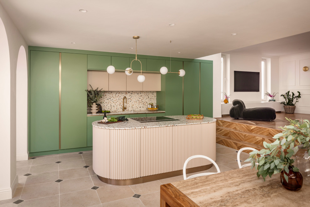 На фото: прямая кухня-гостиная среднего размера в современном стиле с врезной мойкой, плоскими фасадами, зелеными фасадами, столешницей терраццо, разноцветным фартуком, техникой из нержавеющей стали, полом из известняка, островом и разноцветной столешницей с