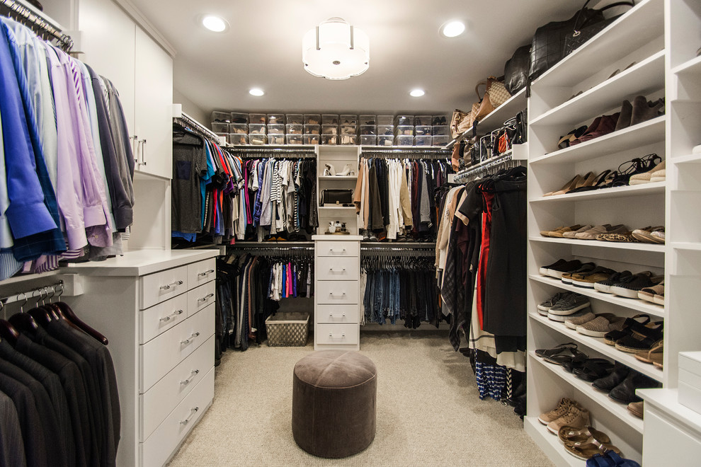 This is an example of a large contemporary gender-neutral walk-in wardrobe in Dallas with flat-panel cabinets, grey cabinets, porcelain floors and white floor.