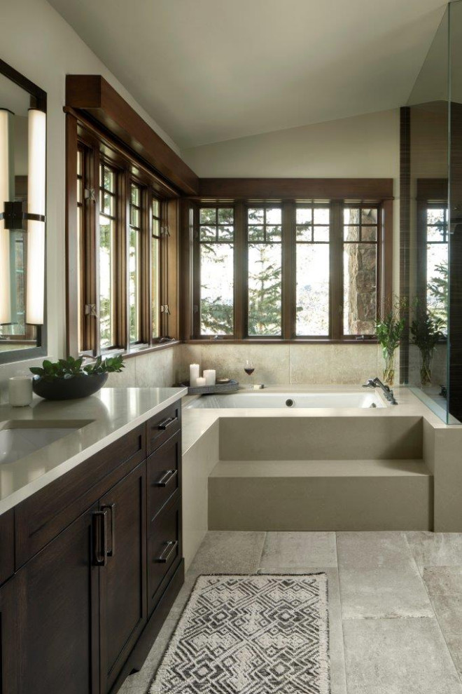 Design ideas for a small country master bathroom in Denver with dark wood cabinets, beige walls, beige benchtops, shaker cabinets, an undermount tub, beige tile, an undermount sink, grey floor, a single vanity, vaulted and a built-in vanity.