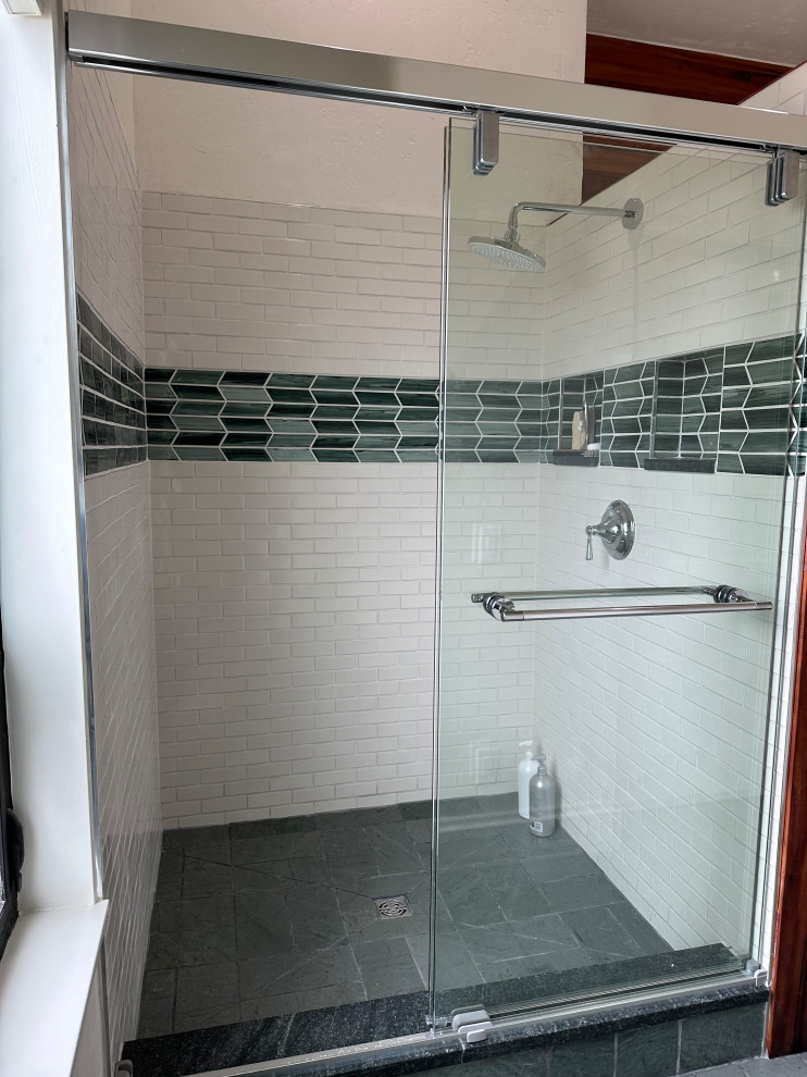 Design ideas for a mid-sized beach style master bathroom in Other with an alcove shower, green tile, subway tile, white walls, slate floors, green floor, a sliding shower screen and a niche.