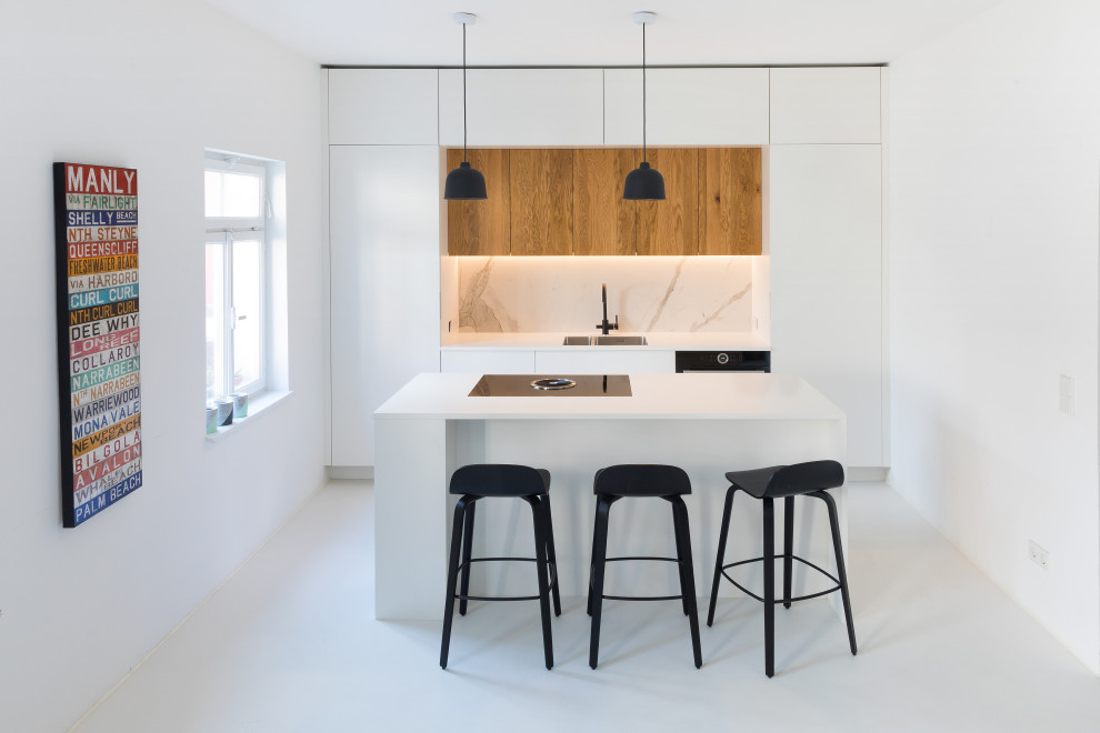 Inspiration for a small contemporary single-wall white floor open concept kitchen remodel in Stuttgart with white cabinets, white backsplash, marble backsplash, an island and white countertops