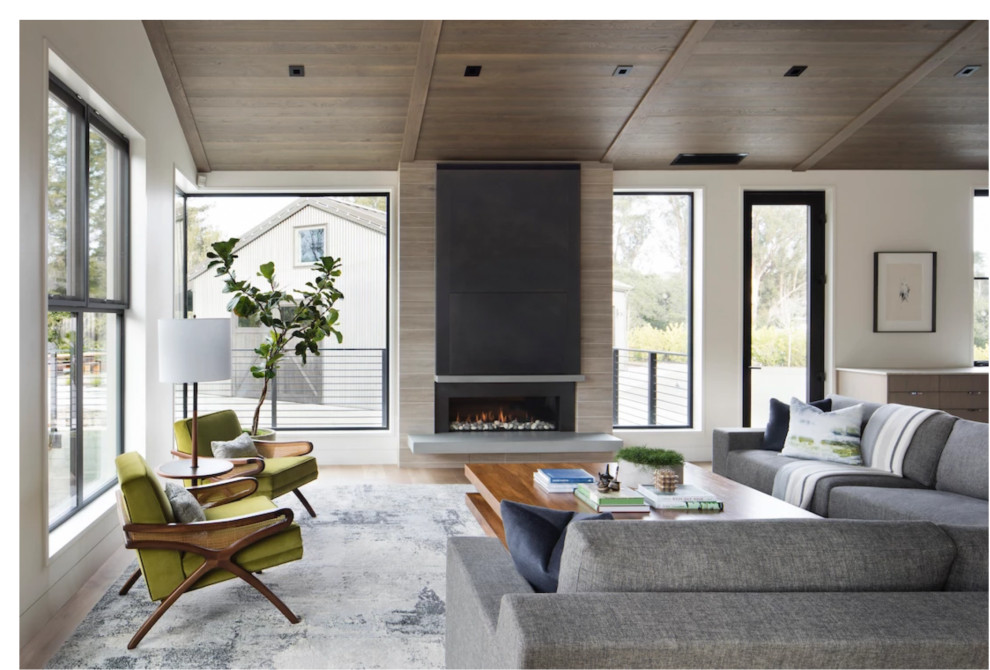 Modern living room in San Francisco with a standard fireplace, a wooden fireplace surround and a wood ceiling.