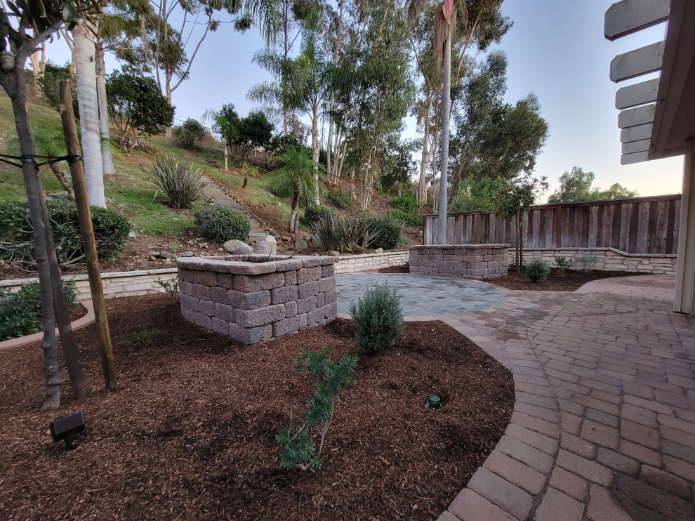 Inspiration for a medium sized rustic back xeriscape full sun garden for summer in San Diego with a raised bed and concrete paving.