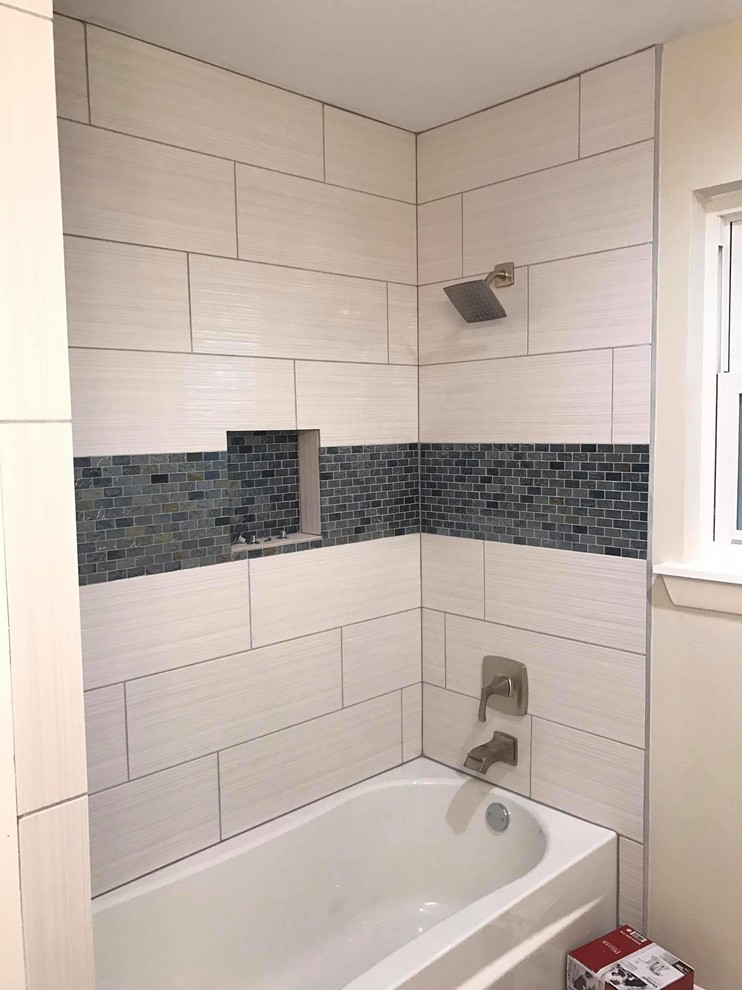 Small transitional kids bathroom in Other with a shower/bathtub combo, blue tile, beige tile, a shower curtain, an alcove tub, porcelain tile and beige walls.
