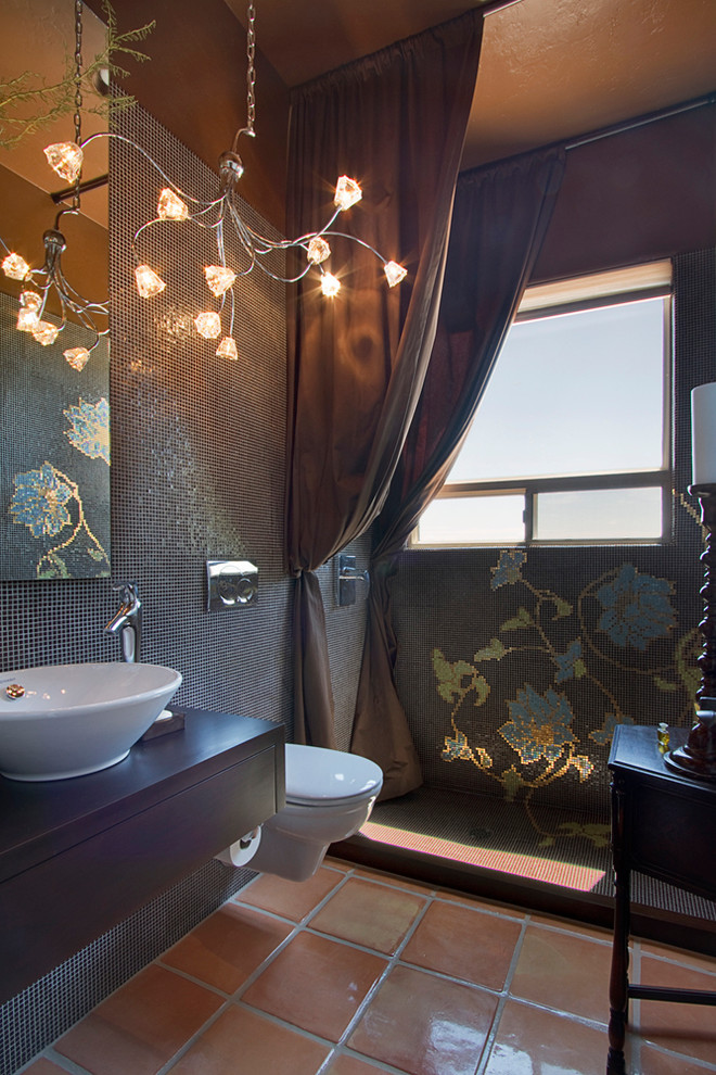 Photo of a contemporary bathroom in Phoenix with mosaic tile, an open shower, a vessel sink, a wall-mount toilet, blue tile, terra-cotta floors and a shower curtain.