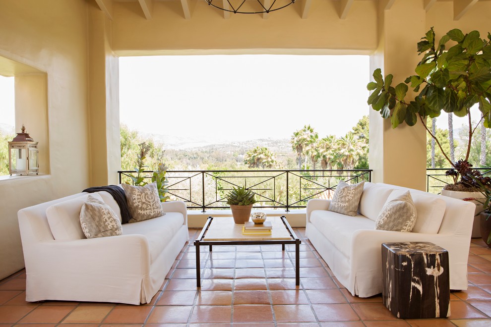 This is an example of a mediterranean balcony in San Diego with a roof extension.