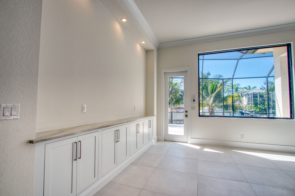 Example of a transitional home design design in Miami