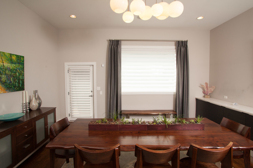 Mid-sized transitional dark wood floor enclosed dining room photo in Chicago with beige walls and no fireplace