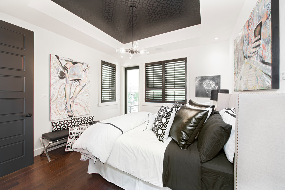 Transitional bedroom in Calgary with white walls and dark hardwood floors.