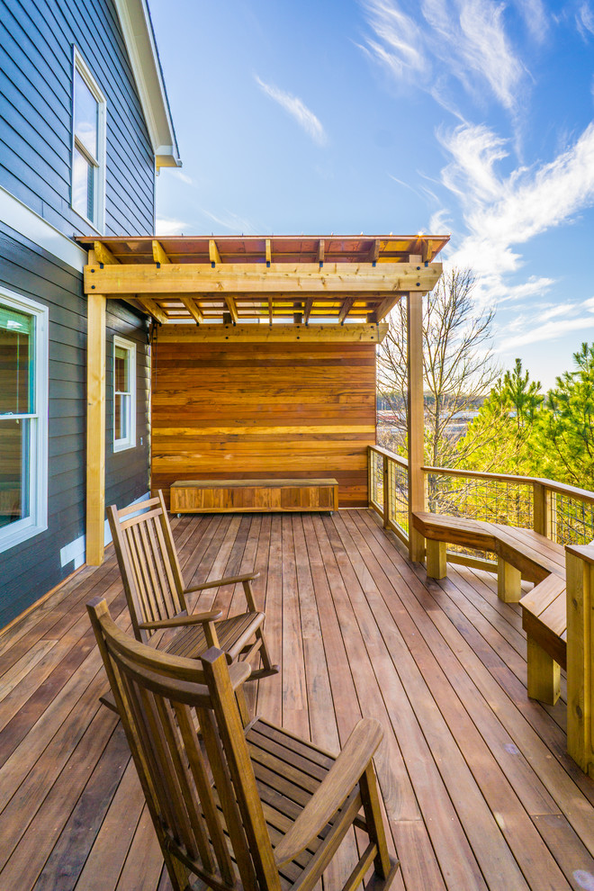 Design ideas for a large contemporary backyard deck in Atlanta with a pergola.