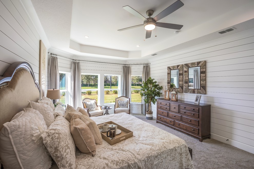 Inspiration for a transitional bedroom in Jacksonville with white walls, carpet and grey floor.