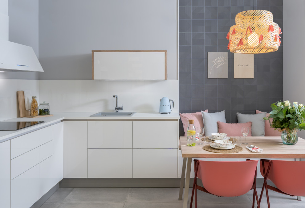 Inspiration for a large modern l-shaped open plan kitchen in Other with a single-bowl sink, flat-panel cabinets, white cabinets, granite worktops, white splashback, ceramic splashback, stainless steel appliances, no island and white worktops.