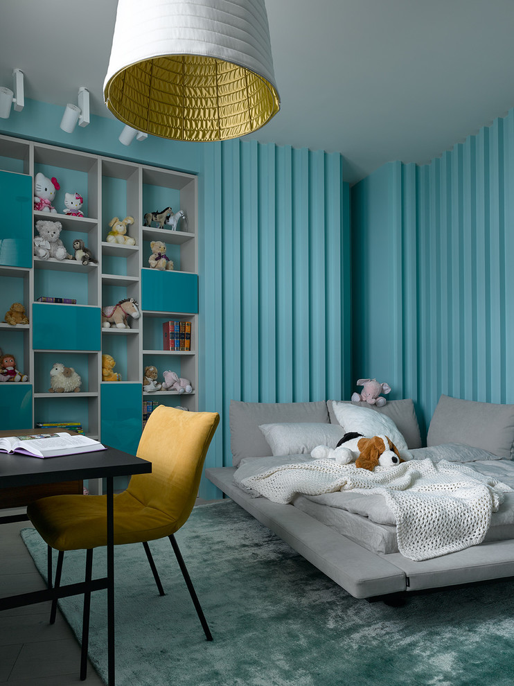 Contemporary kids' bedroom in Other with blue walls and carpet for girls.