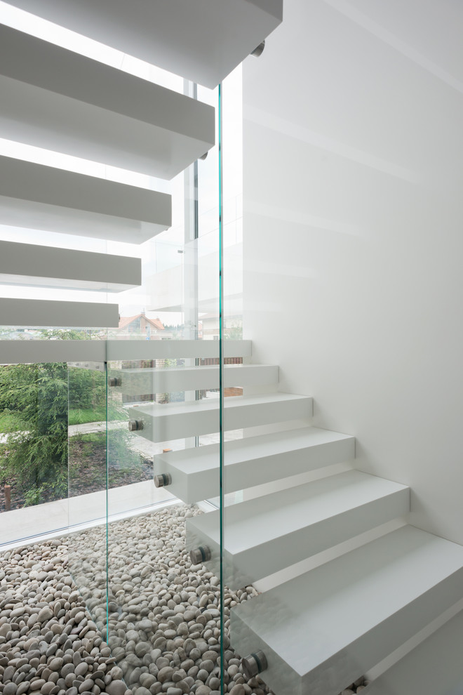Inspiration for a mid-sized contemporary acrylic u-shaped staircase in Moscow.