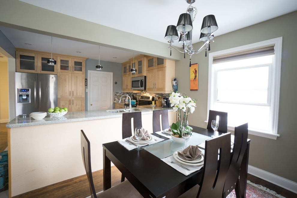 Small transitional dark wood floor enclosed dining room photo with gray walls and no fireplace