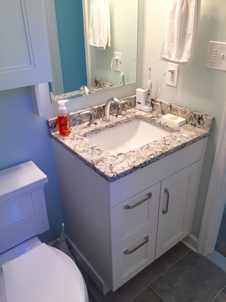 Small transitional master gray tile and porcelain tile porcelain tile alcove shower photo in Baltimore with shaker cabinets, white cabinets, a two-piece toilet, green walls, an undermount sink and quartz countertops