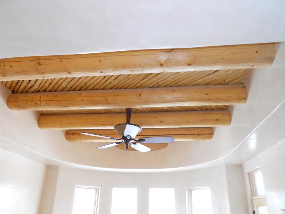 Foyer - mid-sized rustic foyer idea in Albuquerque with white walls