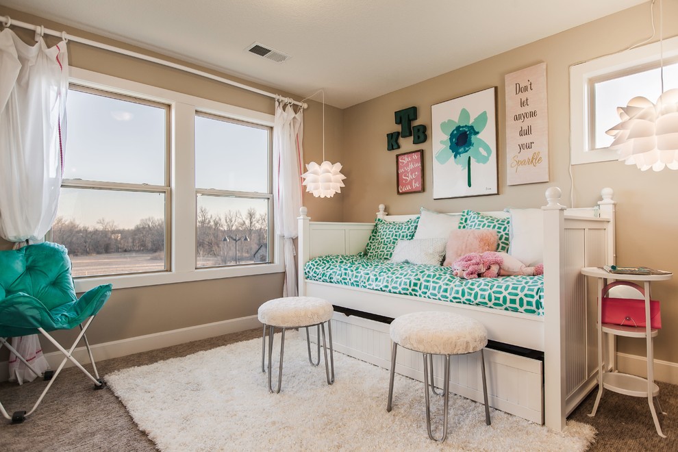 Design ideas for a mid-sized transitional kids' room for girls in Kansas City with beige walls and carpet.