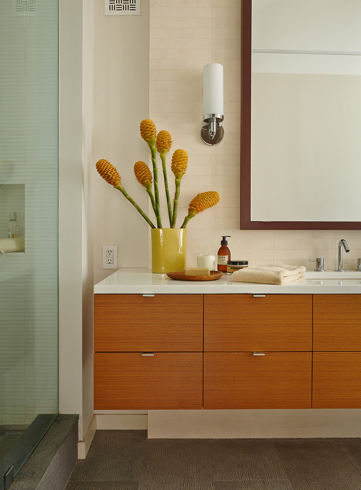 Design ideas for a mid-sized contemporary master bathroom in New York with flat-panel cabinets, medium wood cabinets, an open shower, beige tile, ceramic tile, beige walls, ceramic floors, an undermount sink and grey floor.