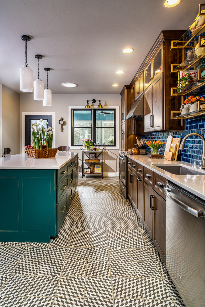Eat-in kitchen - mid-sized traditional u-shaped multicolored floor eat-in kitchen idea with an undermount sink, blue cabinets, quartzite countertops, blue backsplash, subway tile backsplash, stainless steel appliances and an island