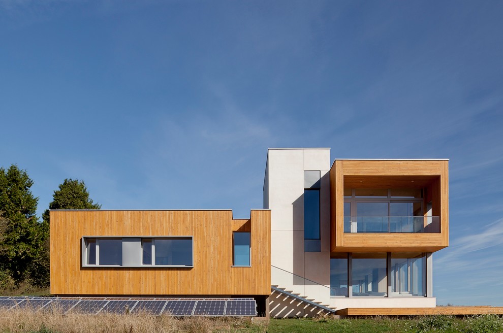 This is an example of a contemporary exterior in Portland with wood siding.