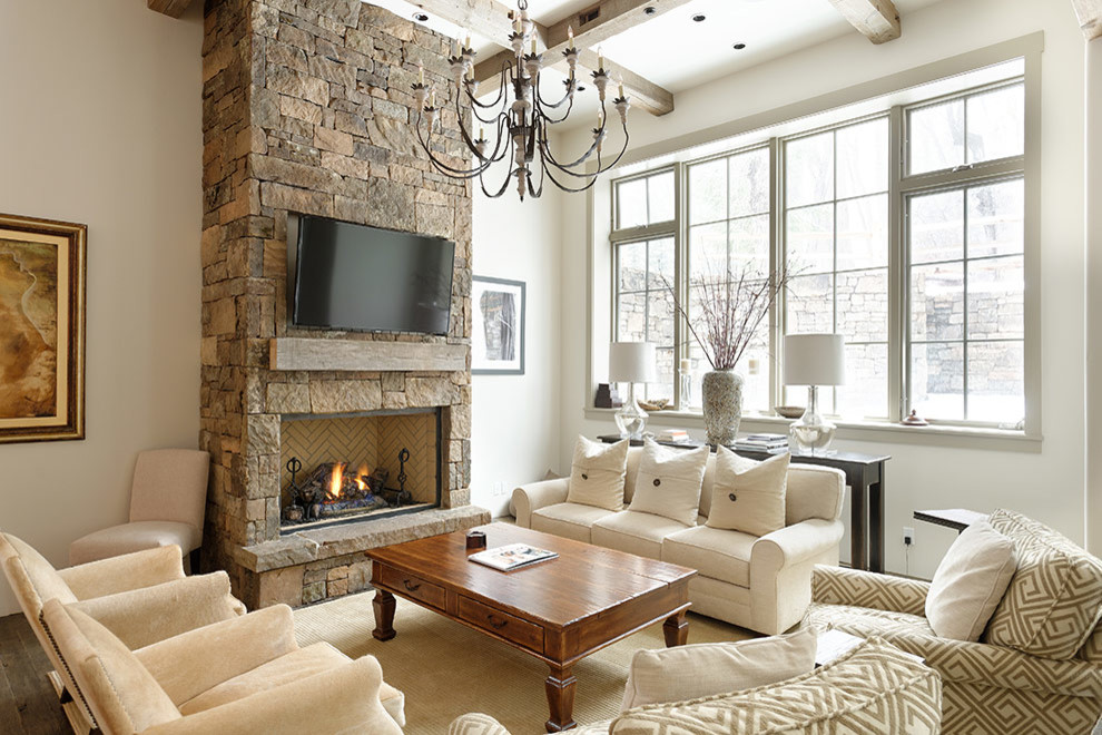 Photo of a large contemporary open concept family room in Denver with white walls, dark hardwood floors, a standard fireplace, a stone fireplace surround, a wall-mounted tv and brown floor.