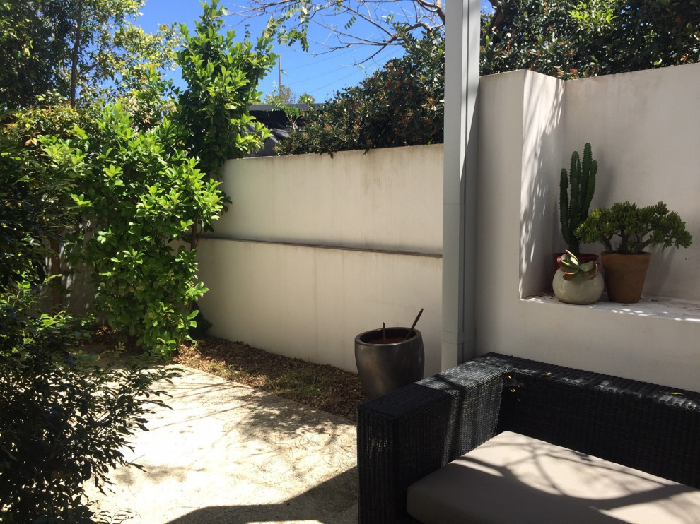 Inspiration for a small mediterranean courtyard patio in Perth with a pergola.