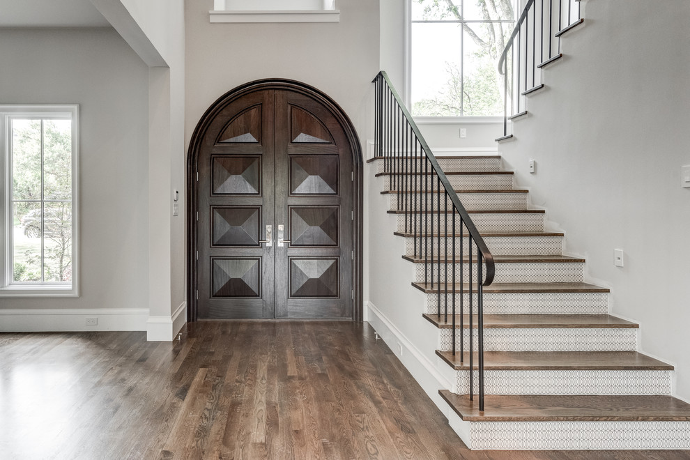 Contemporary foyer in Dallas with white walls, dark hardwood floors, a double front door, a brown front door and brown floor.