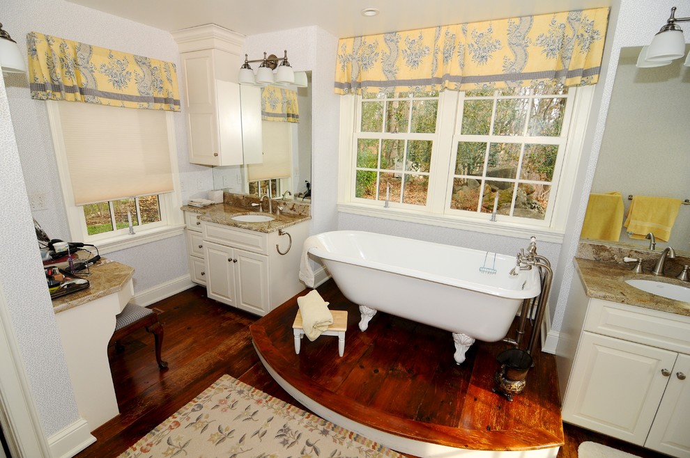 This is an example of a country bathroom in Philadelphia with a freestanding tub.