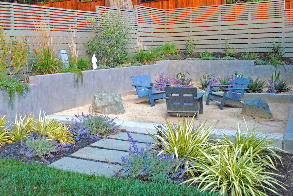 Mid-sized modern backyard xeriscape in San Francisco with a fire feature.