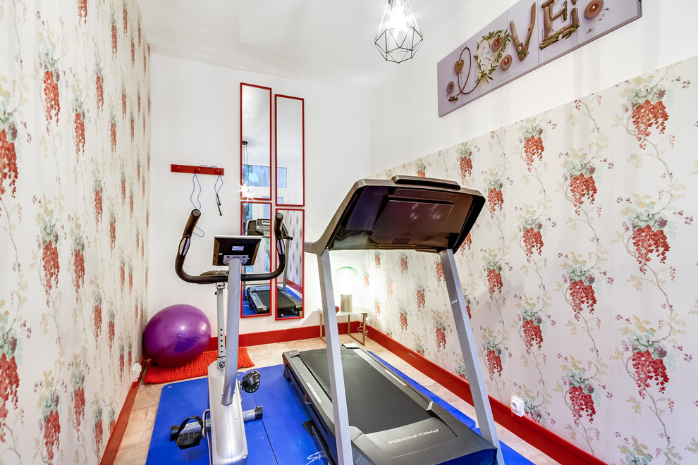 This is an example of a small transitional home gym in Paris with multi-coloured walls.