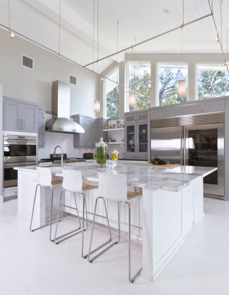 Contemporary kitchen in Orlando with shaker cabinets, grey cabinets, marble benchtops, white splashback, stainless steel appliances and with island.