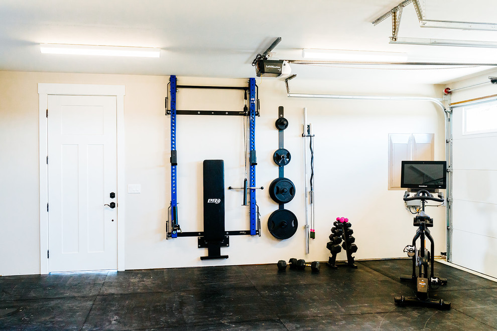 Mid-sized country multipurpose gym in Austin with white walls and black floor.