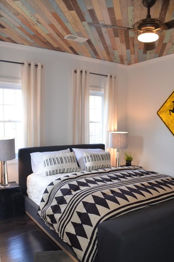 Bedroom - mid-sized transitional guest dark wood floor and brown floor bedroom idea with white walls and no fireplace