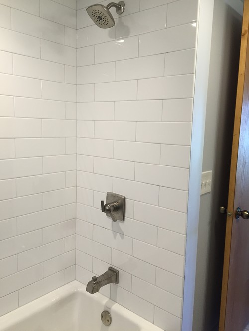 subway tile for Kohler Villager - Here are two photos of our newly finished surround! Tub : Kohler Villager , Tile: American Olean Ice White ,Grout: Color is Silverado ,Fixtures: Delta  Ashlyn