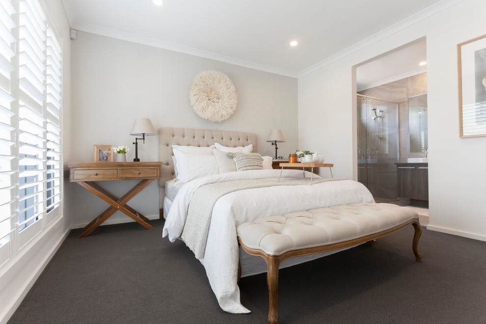 Inspiration for a traditional master bedroom in Melbourne with grey walls, carpet and grey floor.