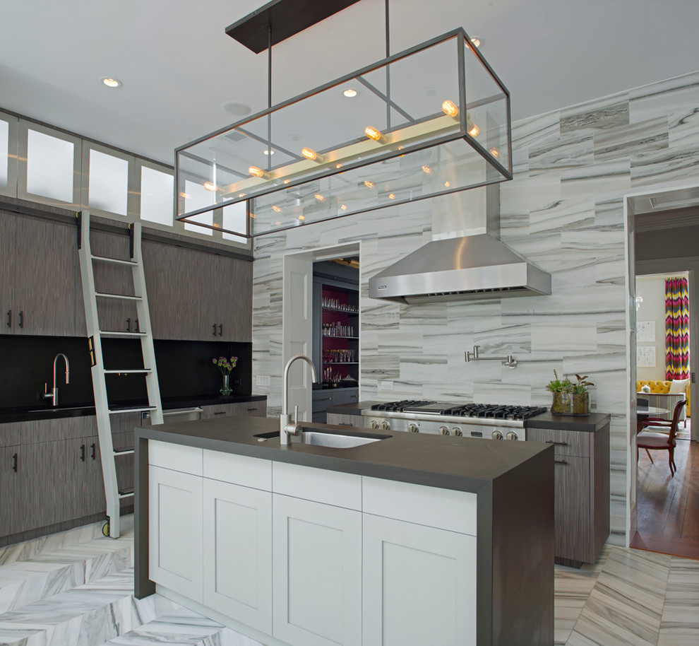 This is an example of a mid-sized contemporary single-wall eat-in kitchen in Atlanta with an undermount sink, flat-panel cabinets, grey cabinets, stainless steel appliances, marble floors, with island, grey splashback, stone tile splashback, solid surface benchtops and grey floor.
