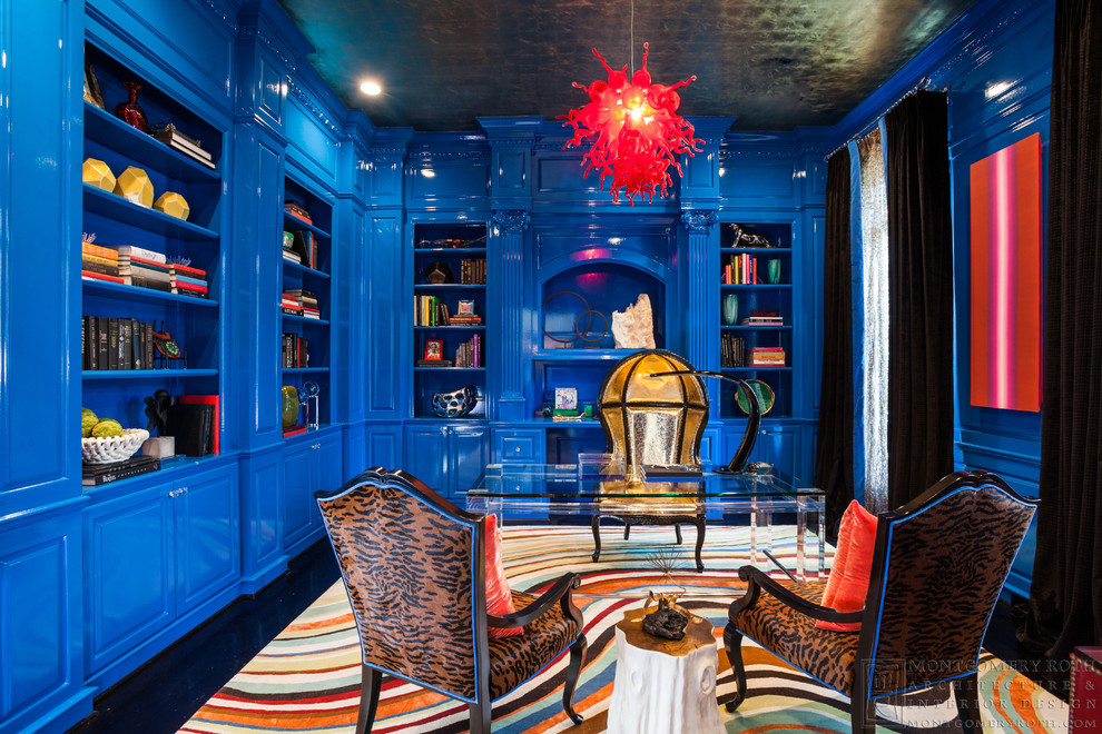 Design ideas for a mid-sized eclectic study room in Houston with blue walls, dark hardwood floors, a freestanding desk and no fireplace.