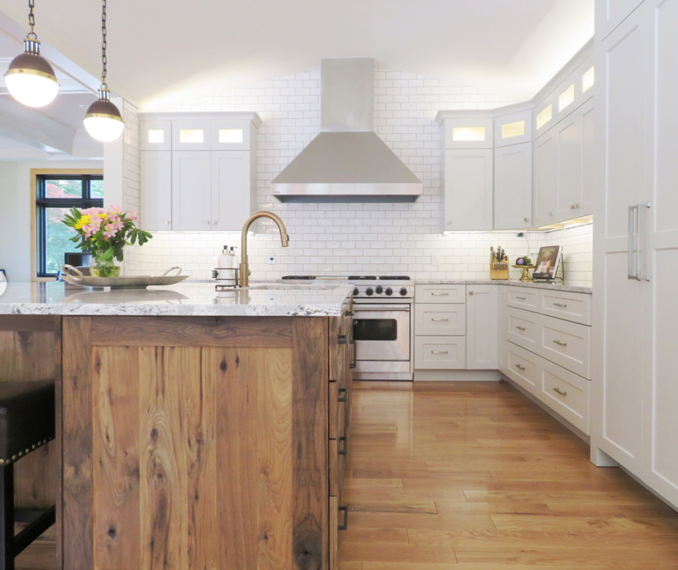 Example of a transitional kitchen design with beaded inset cabinets and medium tone wood cabinets