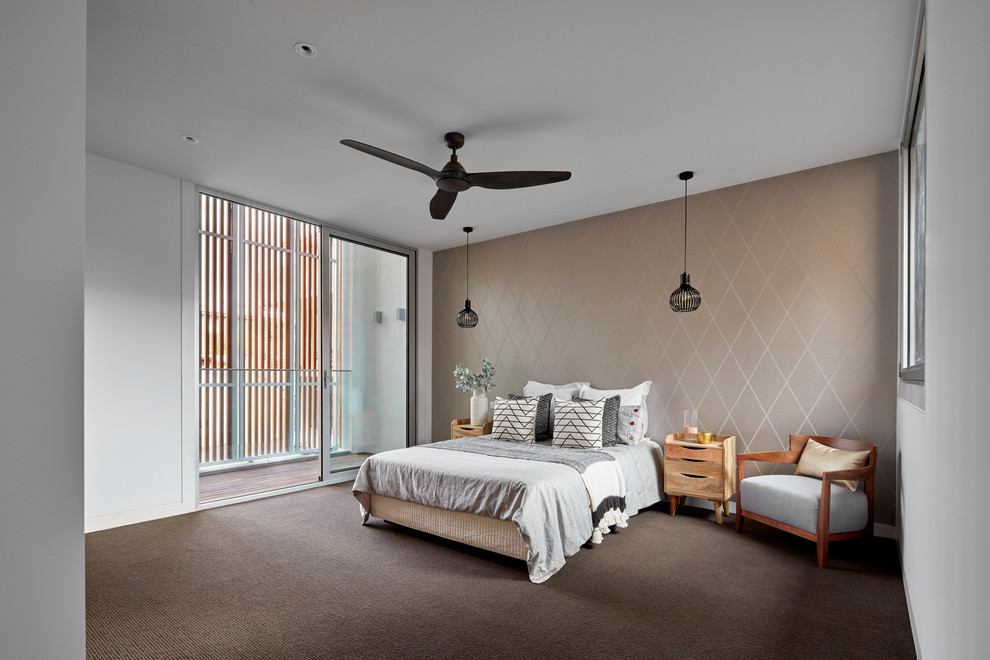 Inspiration for a large contemporary master bedroom in Melbourne with beige walls, carpet and brown floor.