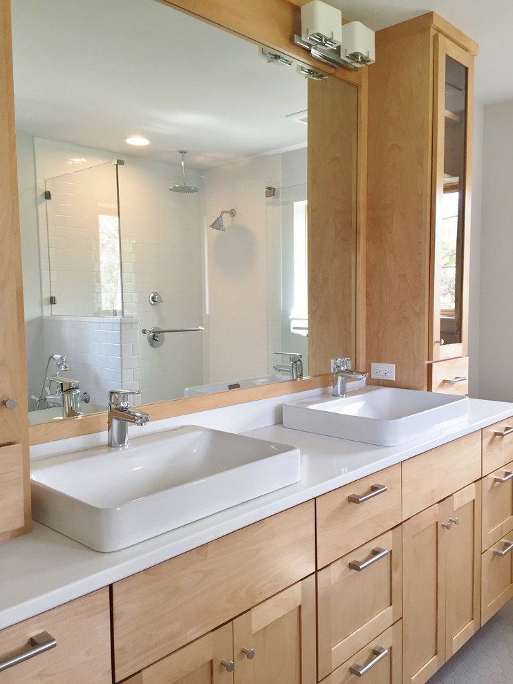 Photo of a mid-sized transitional master bathroom in Chicago with a vessel sink, shaker cabinets, light wood cabinets, engineered quartz benchtops, a corner shower, white tile, subway tile, grey walls and mosaic tile floors.