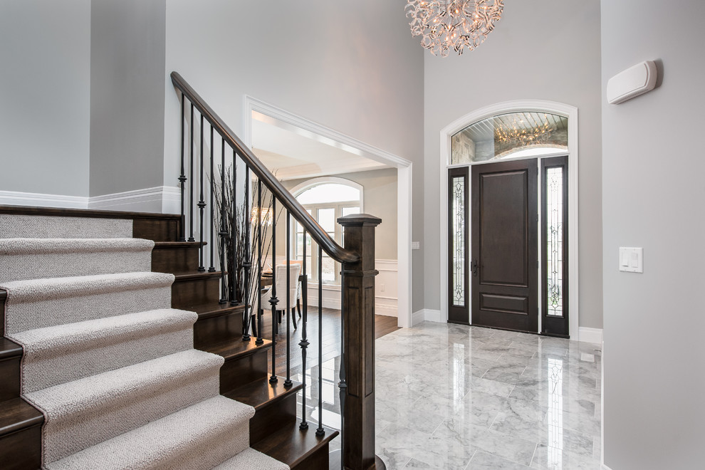 Example of a transitional home design design in Toronto