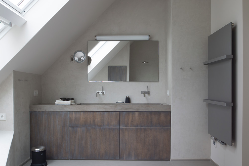 Large contemporary bathroom in Berlin with flat-panel cabinets, grey walls, dark wood cabinets, a drop-in tub, a curbless shower, stone slab, an integrated sink, marble benchtops, grey floor and an open shower.