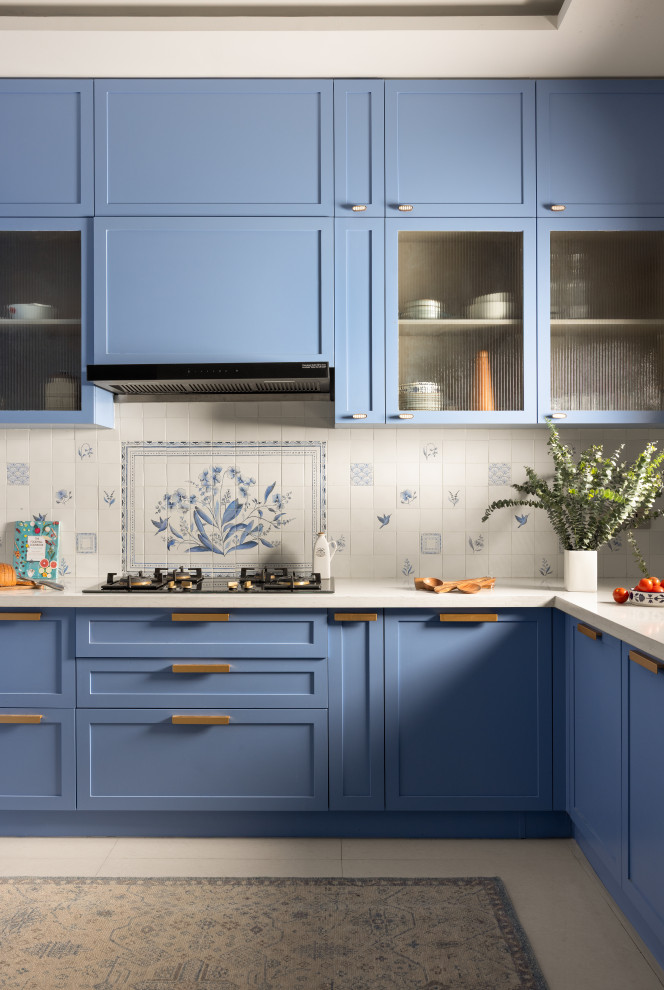 This is an example of a contemporary L-shaped kitchen in Bengaluru With Shaker Cabinets, Blue Cabinets and No Island.
